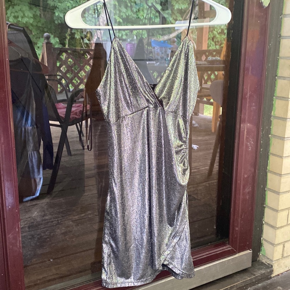 This dress is from forever 21! It is a size medium, and has silver shimmers!